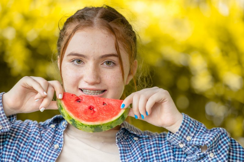 Patient eating watermelon with braces