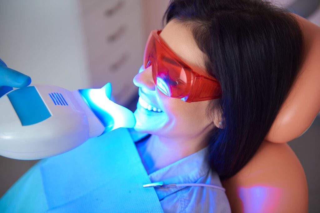 A woman getting her teeth professionally whitened.