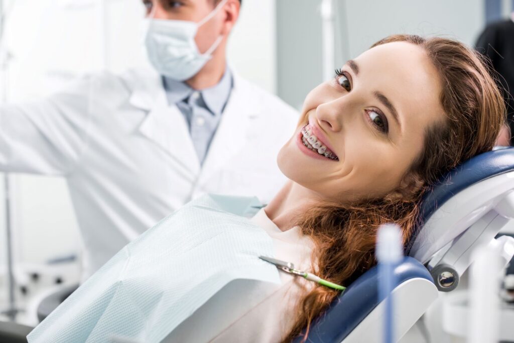 A girl with braces in an orthodontist’s chair